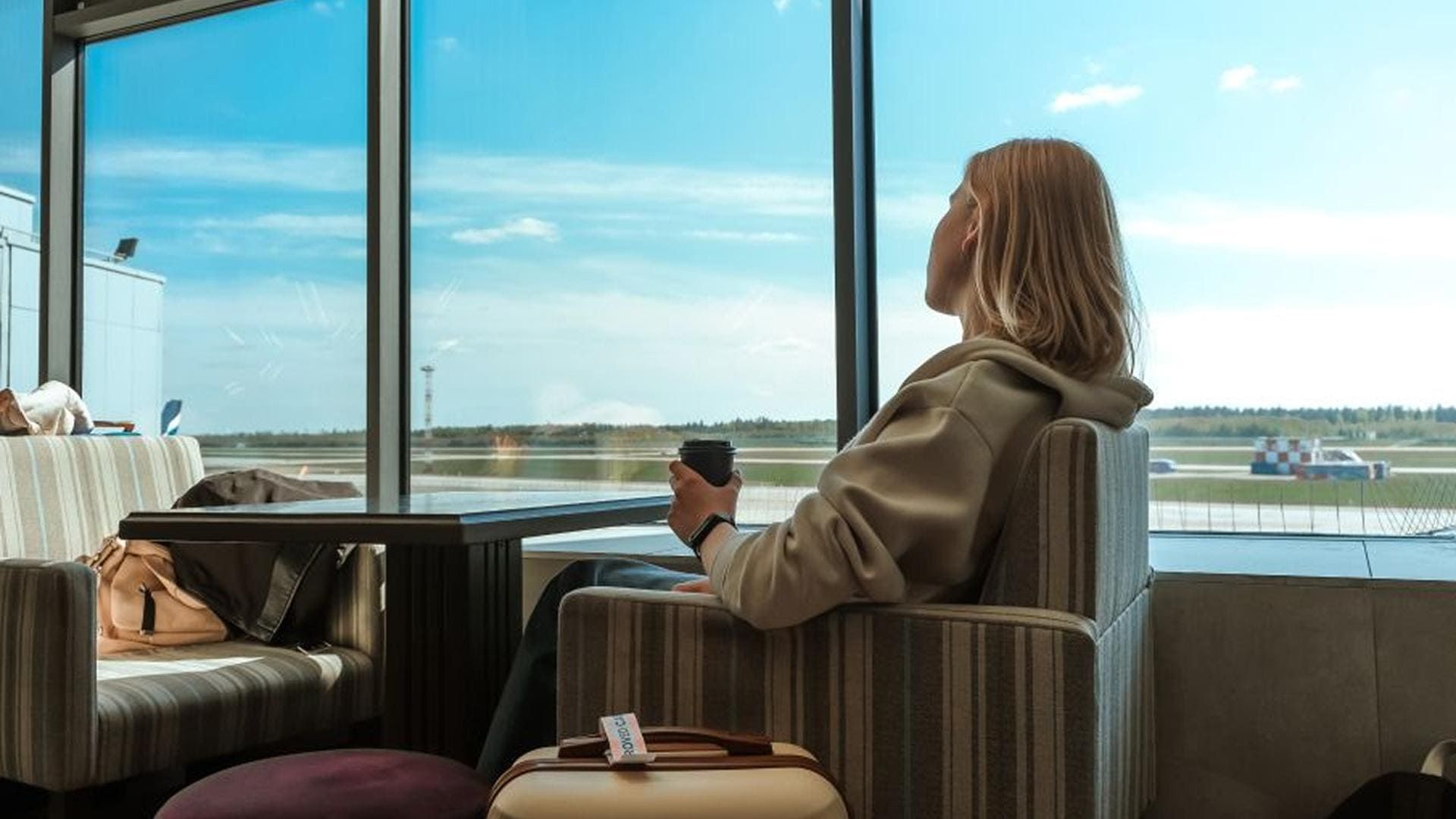Business class passenger at a US airport before a flight to Germany