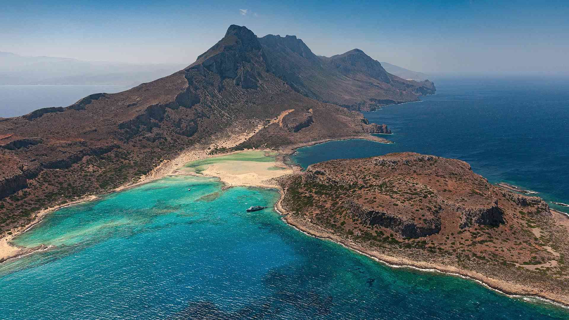 Rocky coastline and turquoise water on the coast of Crete