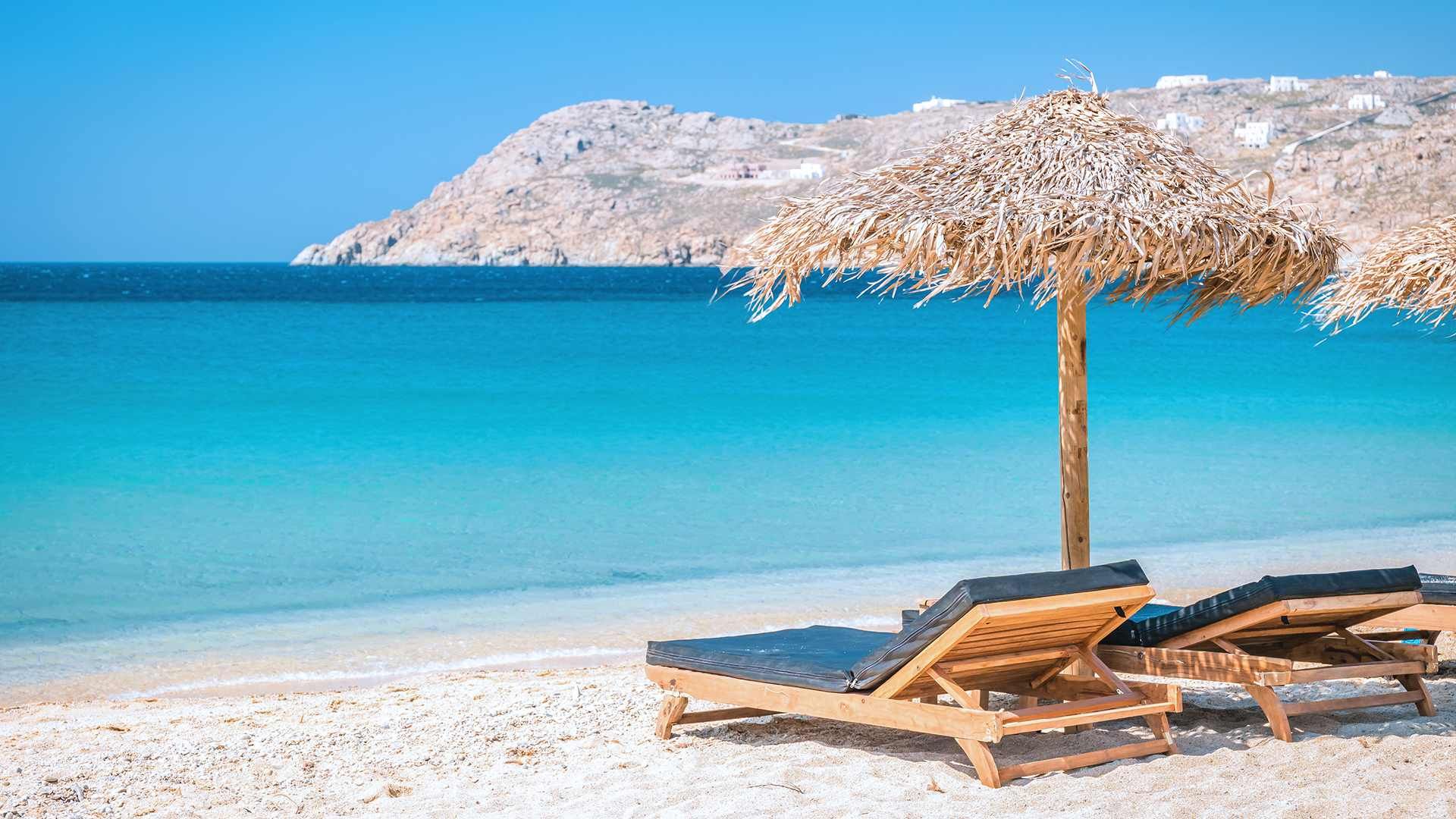 Windmills and whitewashed buildings on the waterfront in Mykonos