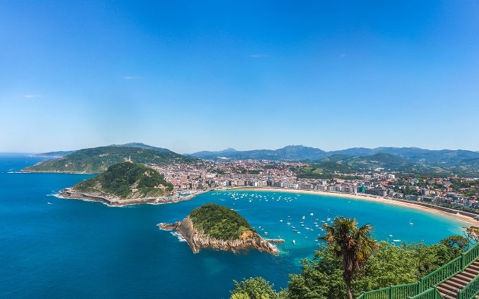 La Concha bay in San Sebastián on a clear July evening — northern Spain peaks in summer