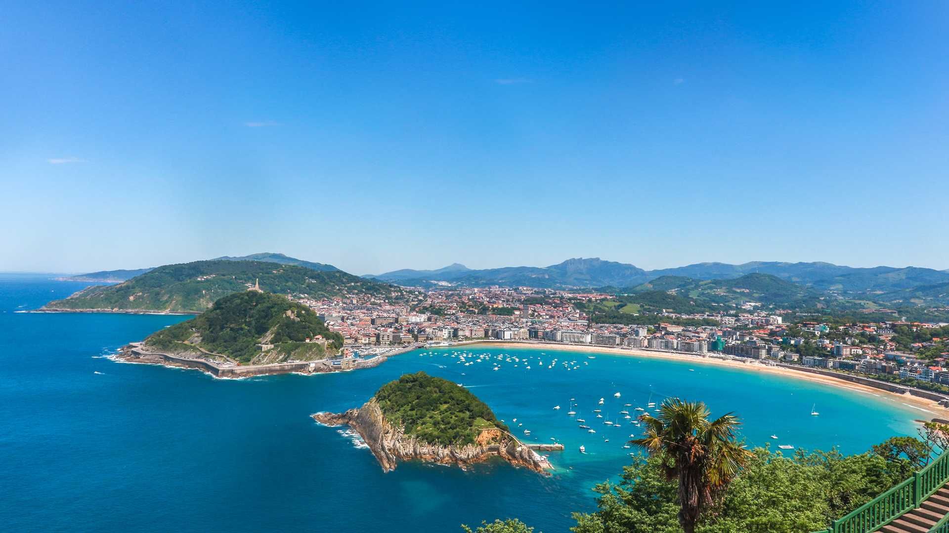 La Concha bay in San Sebastián on a clear July evening — northern Spain peaks in summer