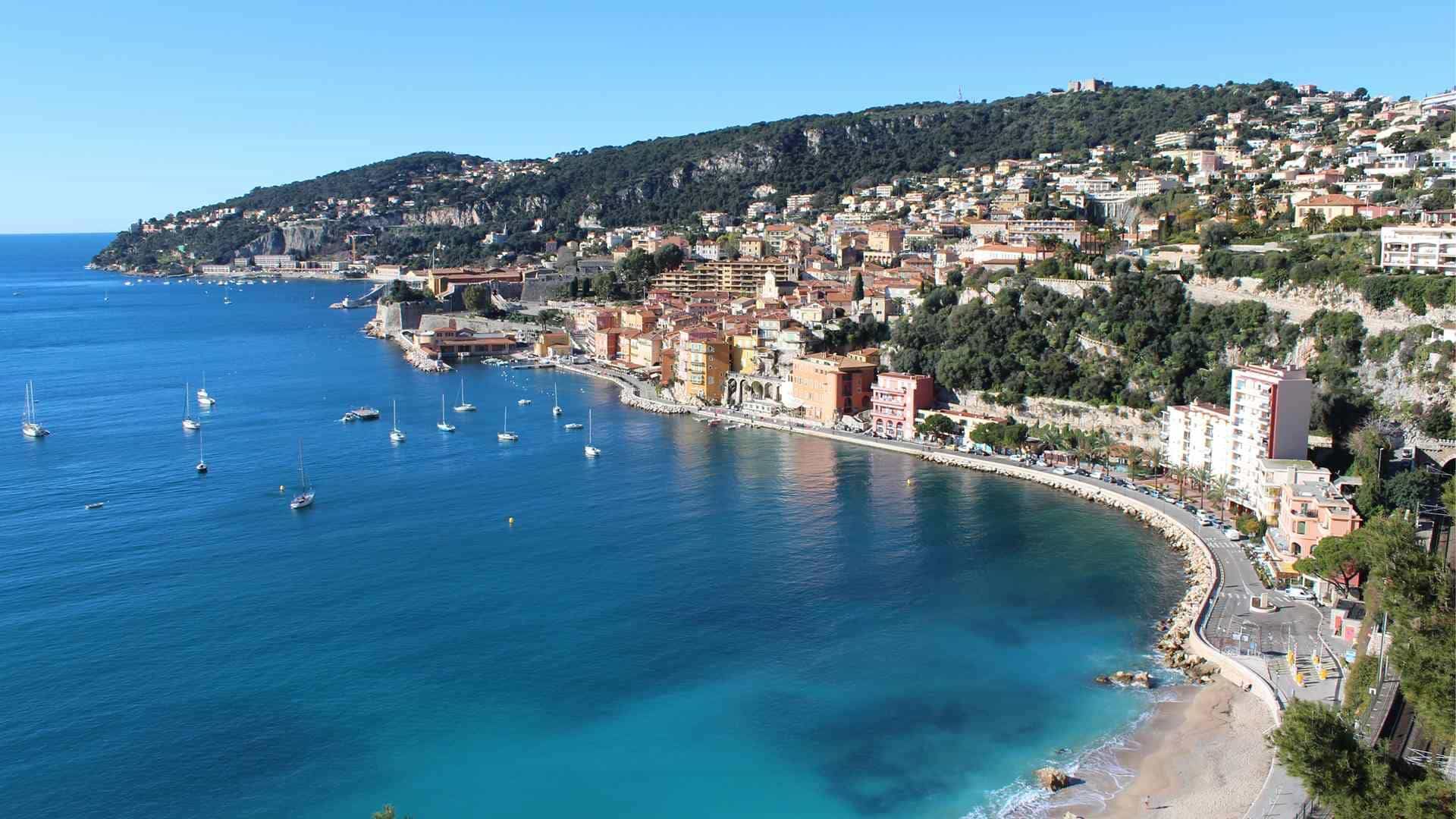 Swimmers at Villefranche-sur-Mer in September — the warmest sea of the year on the French Riviera