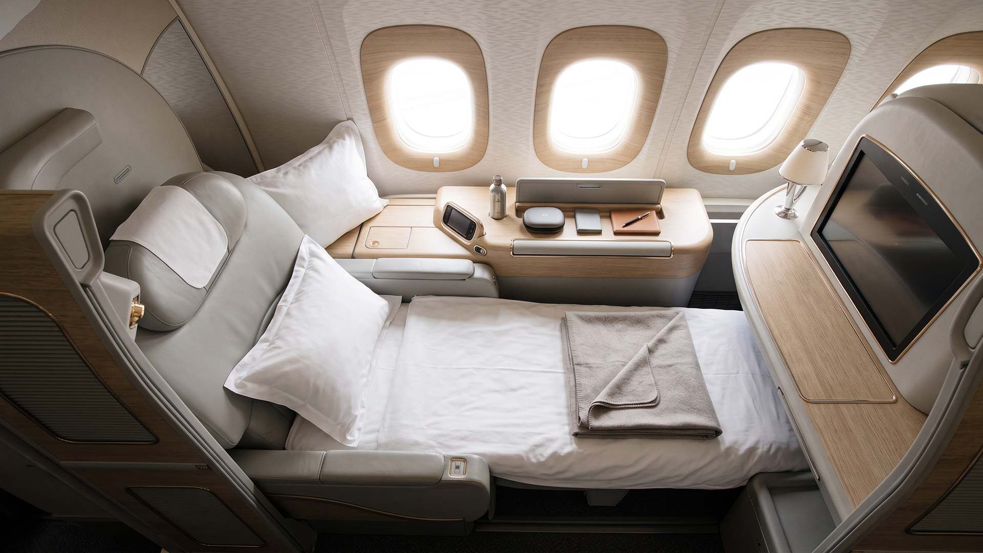 Fully flat business class bed with direct aisle access