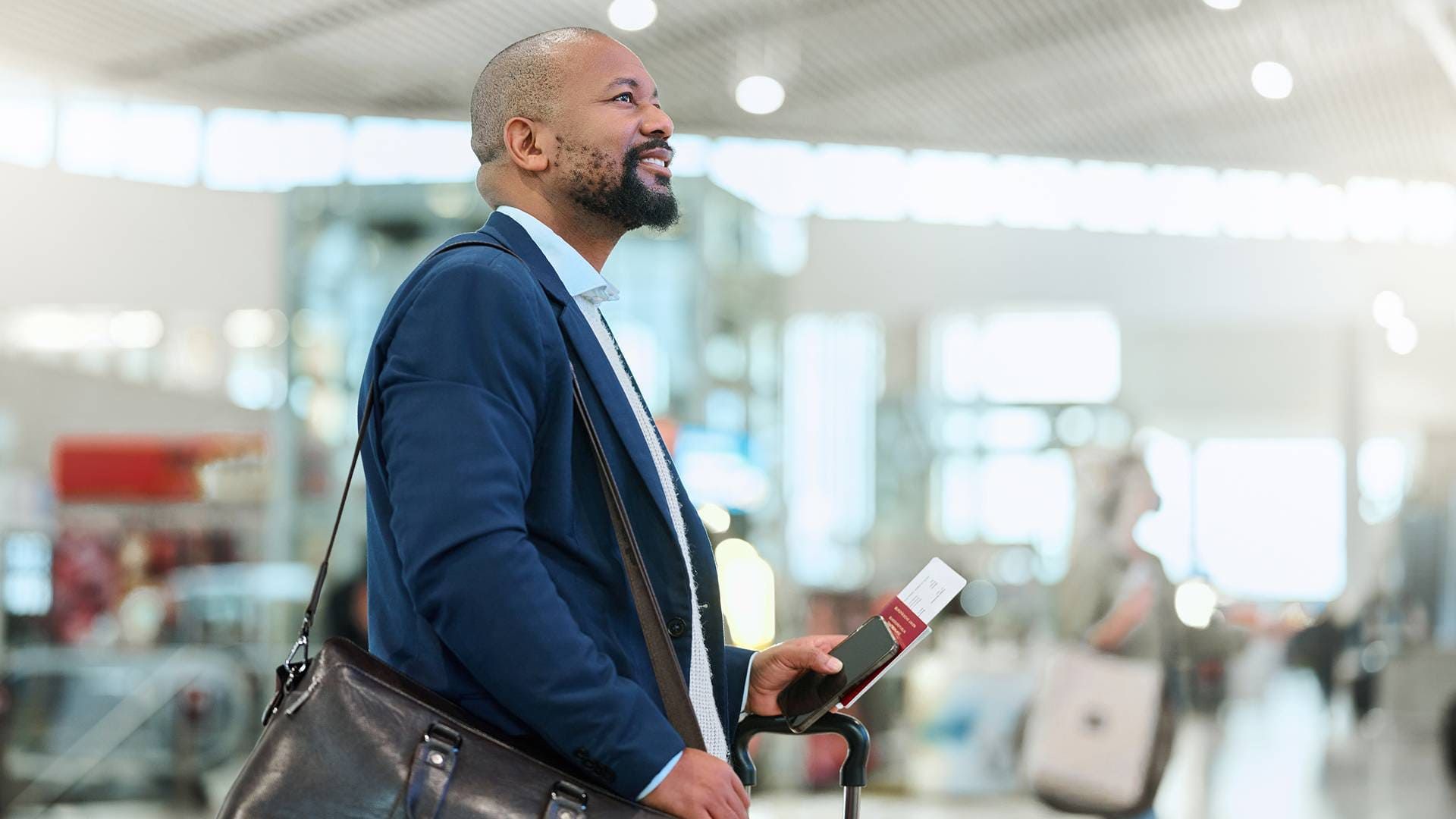 Business class traveler at a US airport before a flight to Africa