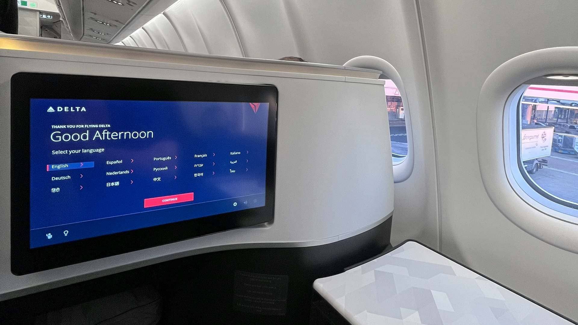 Delta One seatback entertainment screen in a business class suite