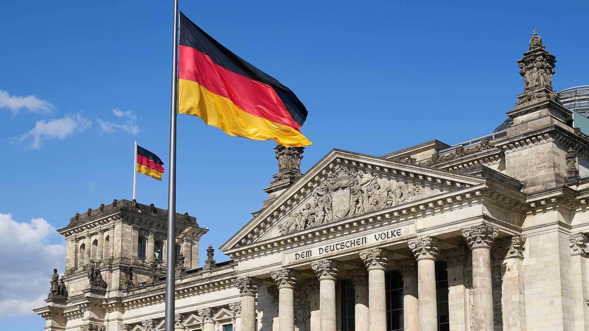 Reichstag building in Berlin with the German flag