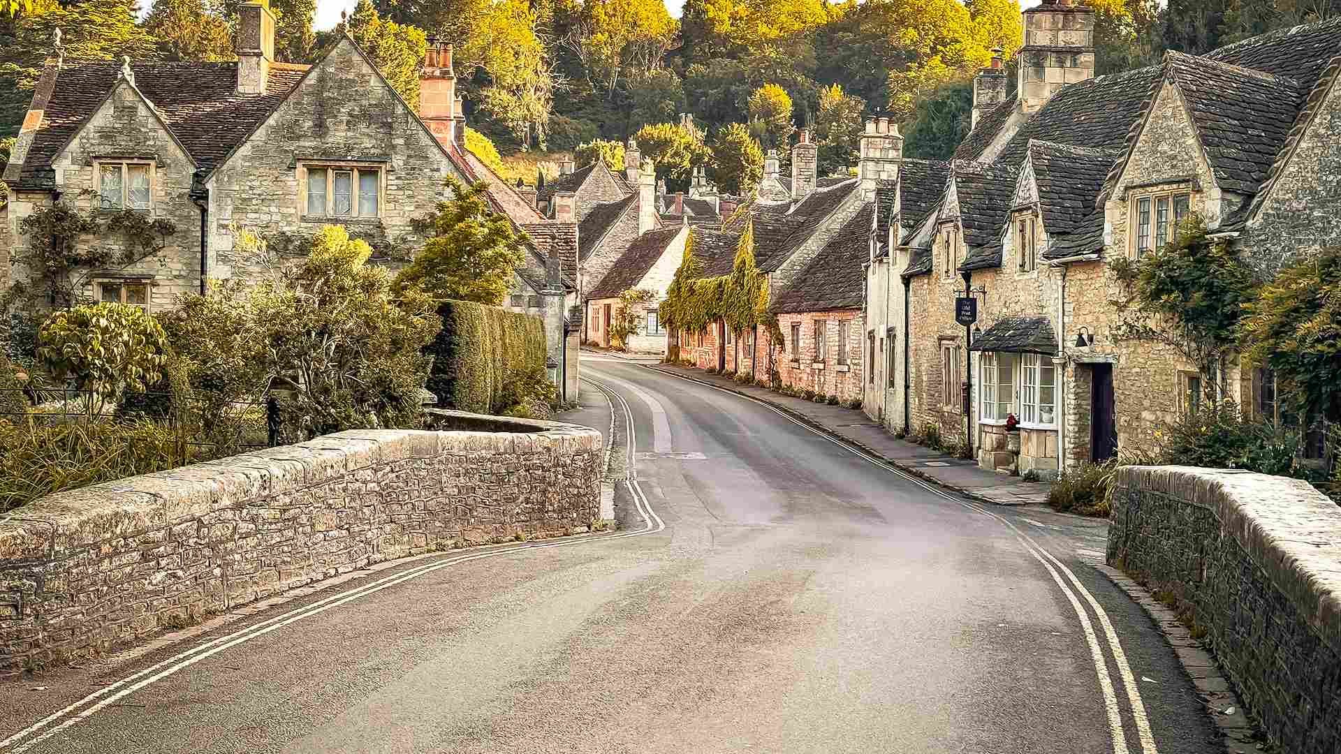 An empty English village lane at golden hour in late September